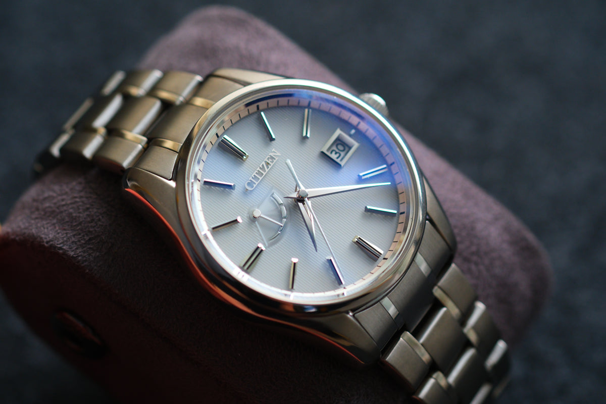 The Citizen Chronomaster AQ1020-51A Titanium Eco Drive Brushed-stripe White dial Box Manual User Excellent Condition