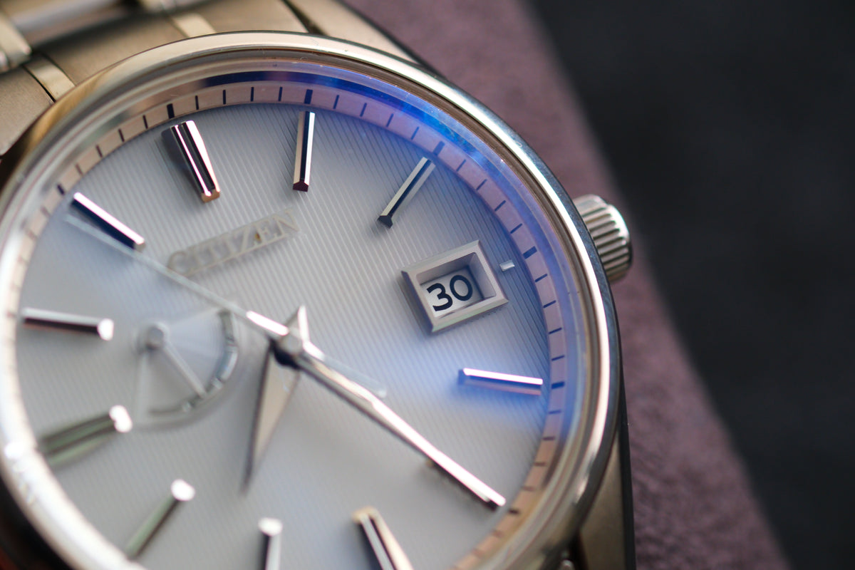 The Citizen Chronomaster AQ1020-51A Titanium Eco Drive Brushed-stripe White dial Box Manual User Excellent Condition