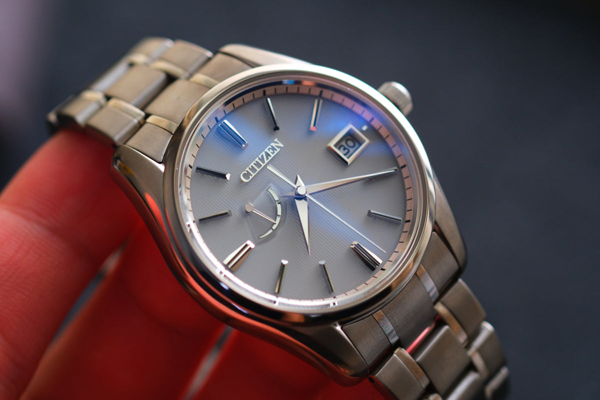 The Citizen Chronomaster AQ1020-51A Titanium Eco Drive Brushed-stripe White dial Box Manual User Excellent Condition