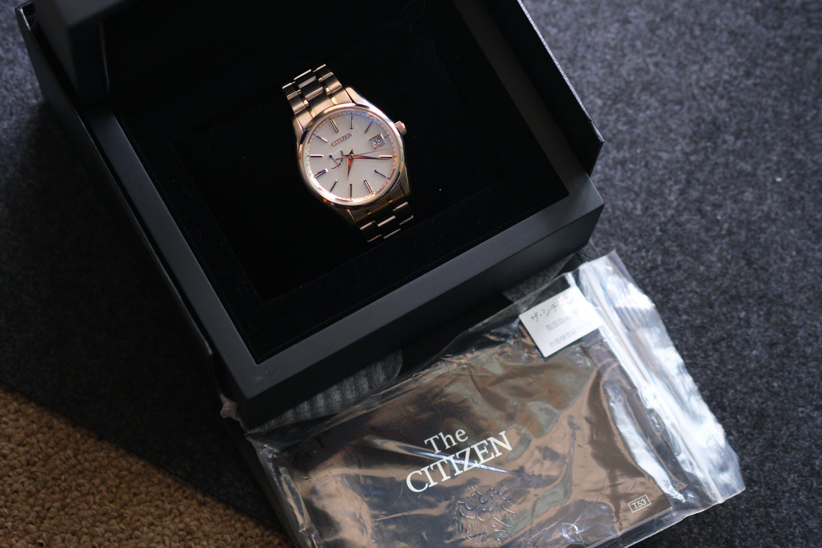 The Citizen Chronomaster AQ1020-51A Titanium Eco Drive Brushed-stripe White dial Box Manual User Excellent Condition