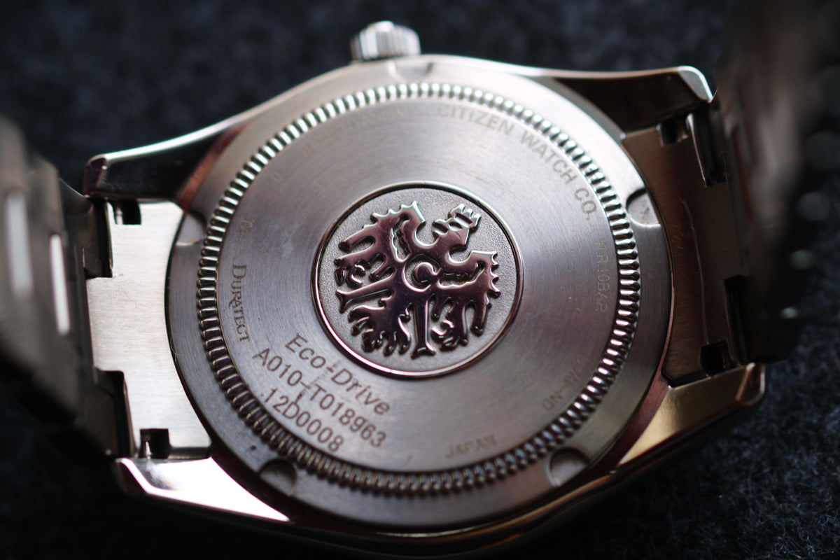 The Citizen Chronomaster AQ1020-51A Titanium Eco Drive Brushed-stripe White dial Box Manual User Excellent Condition